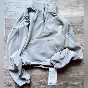 New with tag Lululemon Brushed Softstreme Half Zip size 6. Color is riverstone